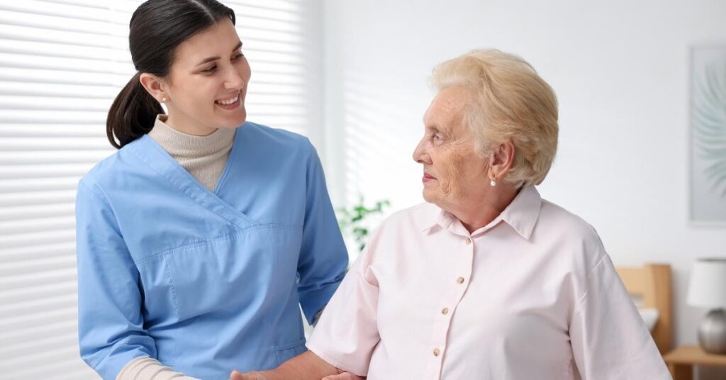 Home health nurse assisting a senior patient at home to reduce hospital readmissions through professional New York home health care support.